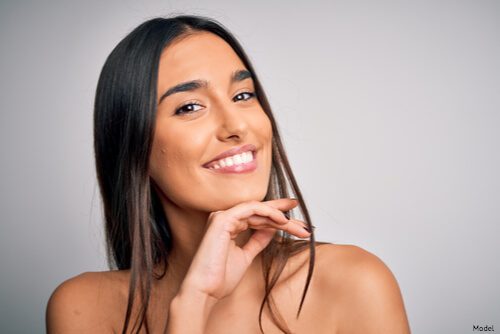woman resting her head on her hand