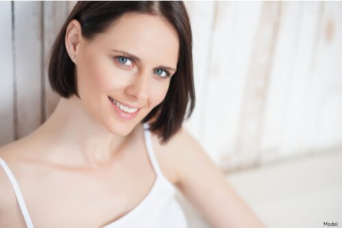 woman sitting on her couch