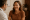 smiling woman having a consultation with a doctor in a clinic.